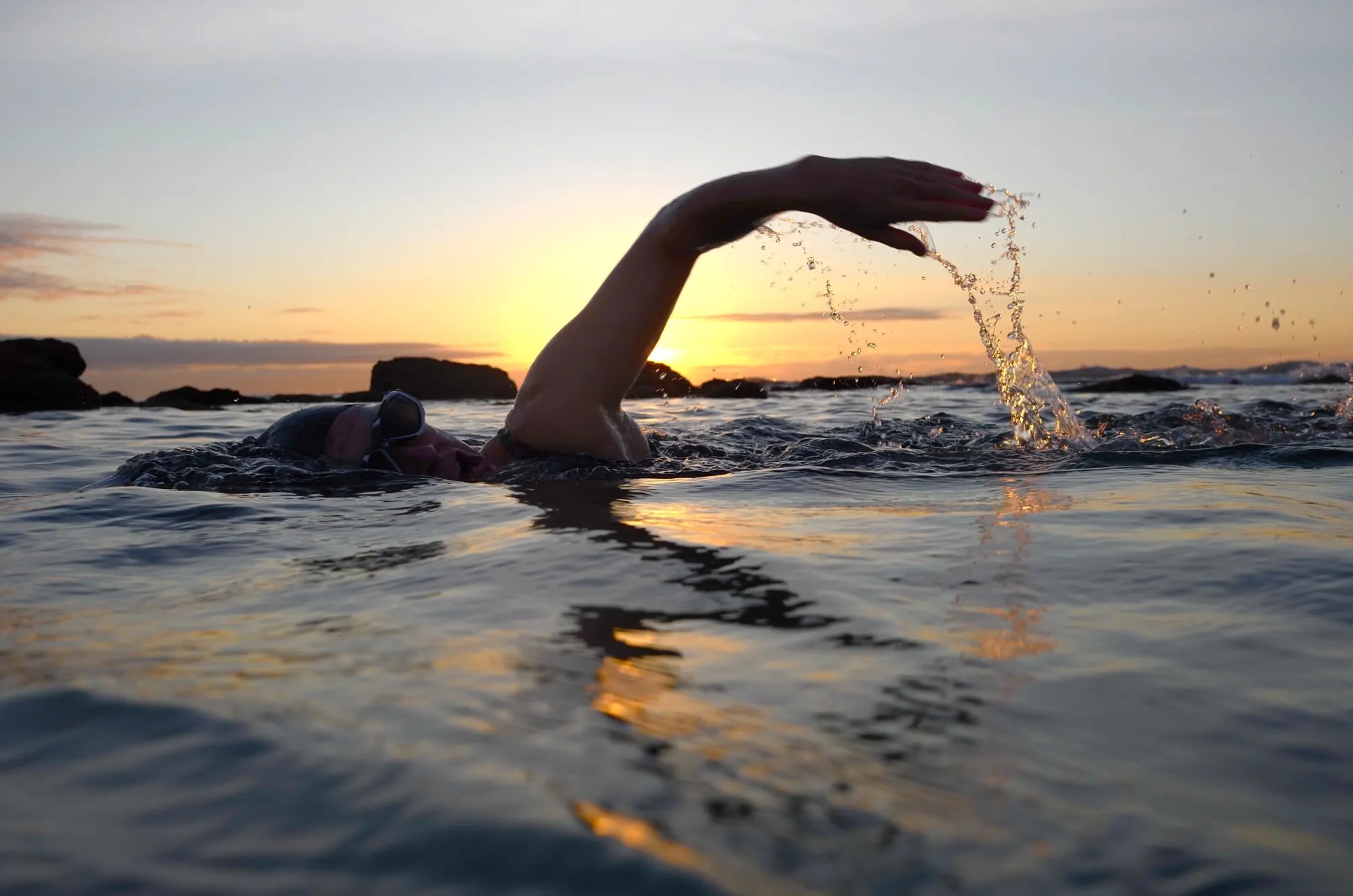 open water swim triathlon triathlete kicking while breathing